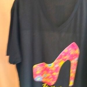 Unisex black designer shirt  sells new with tag for $55. Selling at a d discount